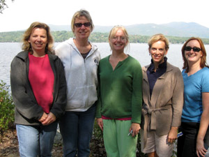 Five participants outside in front of a lake.